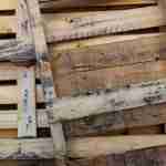 stack of shipping pallets leaning against each other