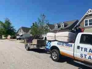 Trash and Stash pickup hauling furniture to donation center