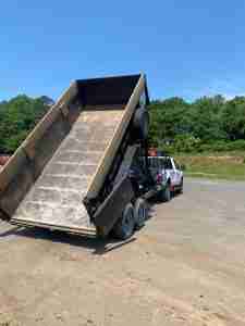 Trash and Stash pickup emptying dump trailer