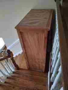 dresser halfway down stairs