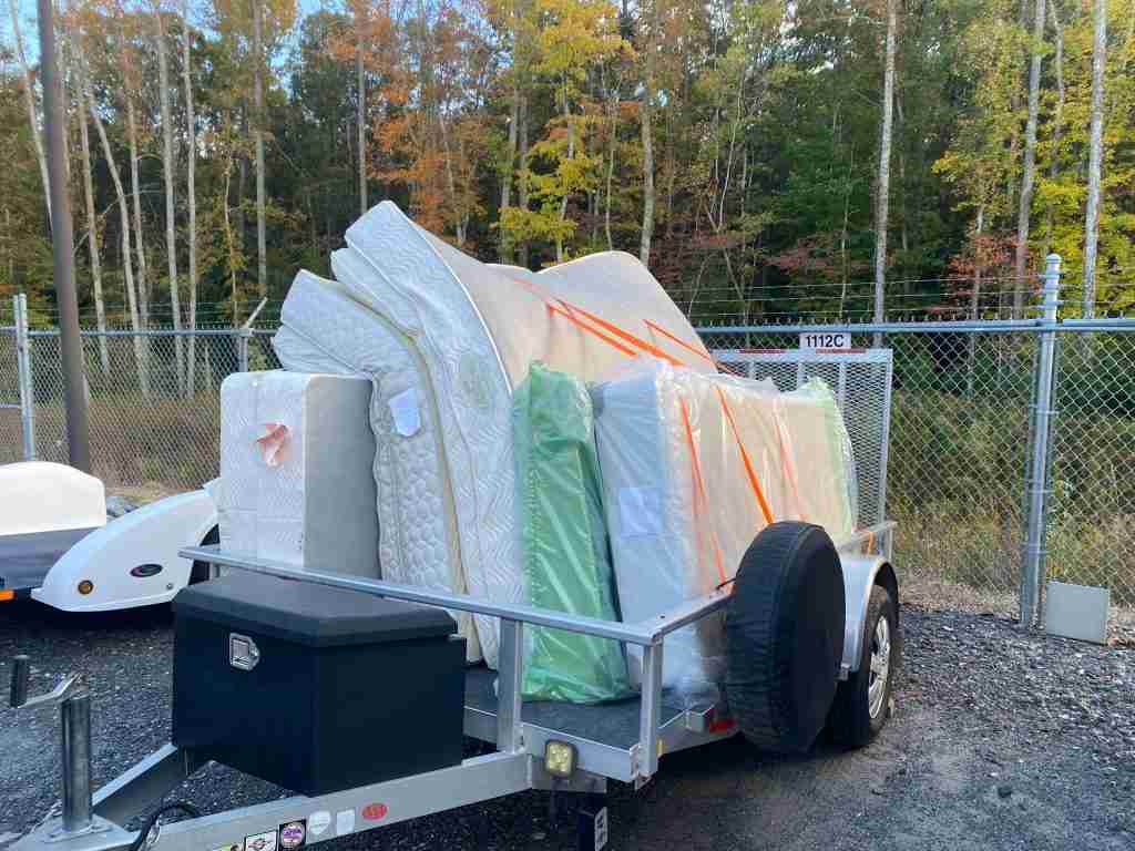 Trash and Stash Trailer full of mattresses