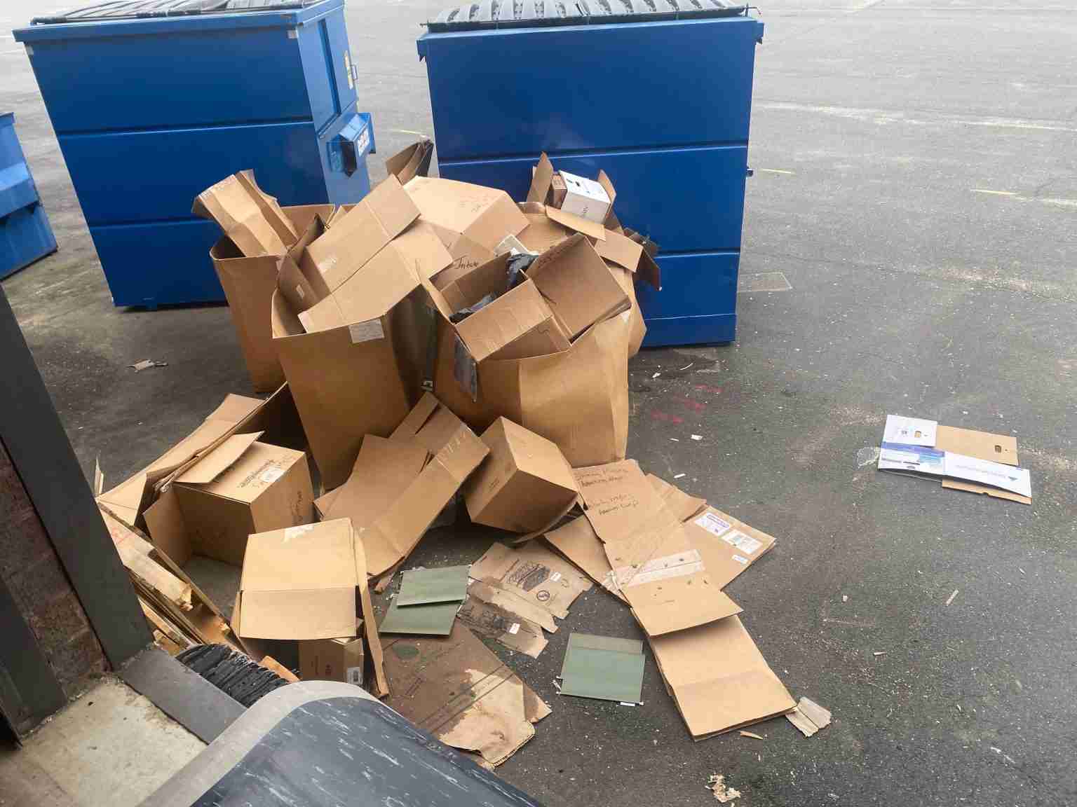 Removing cardboard boxes and shipping material from loading dock