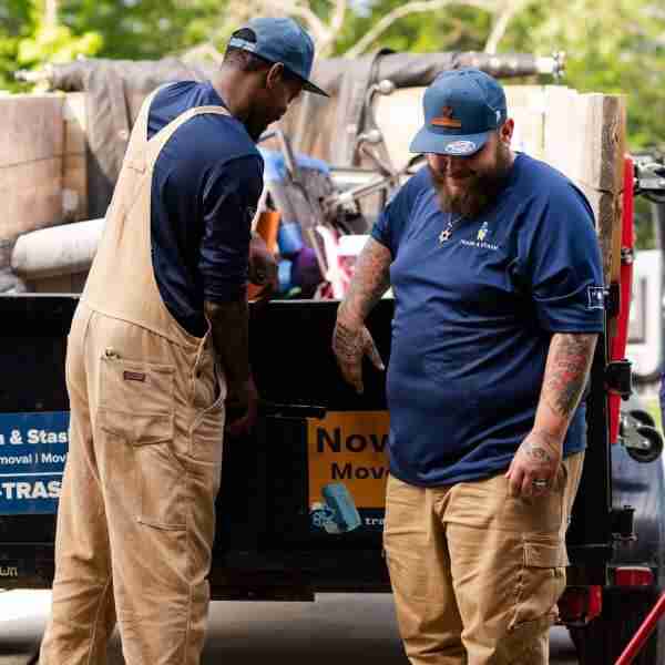 Trash and Stash Employees load a trailer in Charlotte